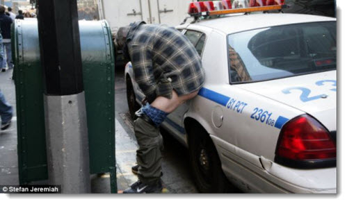 occupy-wall-street-man-pooping-on-police-car-oct-2011
